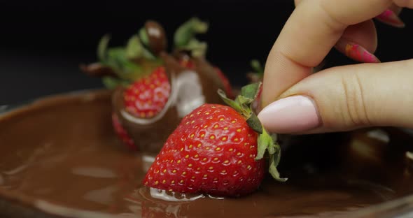Hand Dipping Strawberry in Melted Chocolate. Fresh Berries Sweet Dessert Food alt