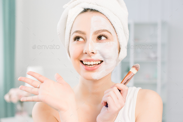 happy-and-emotional-spa-girl-applying-face-mask-aesthetic-procedure-stock-photo-by-sofiiashunkina