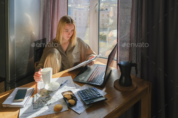 Investments. Young woman investor buys stocks on the stock exchange stock market from home - Stock Photo - Images