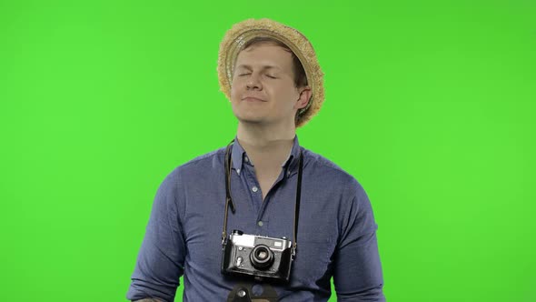 Portrait of Man Tourist Photographer Relaxing with Closed Eyes. Chroma Key alt