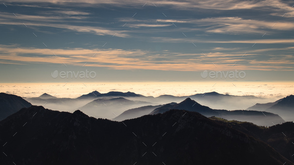 Mountain landscape shrouded in fog - Stock Photo - Images