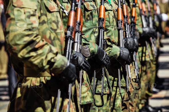 Military force uniform soldiers standing in a row Stock Photo by rachwal