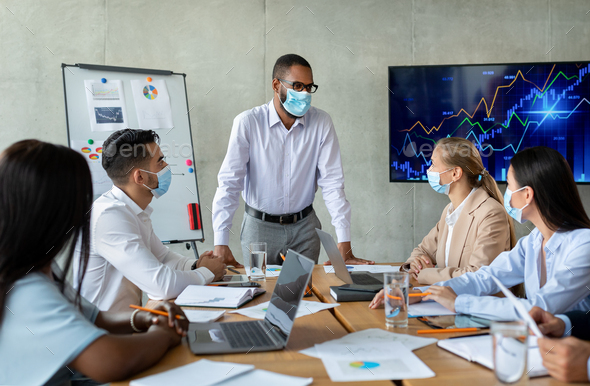Corporate Meeting. Black Boss Wearing Face Mask Having Business Conference With Collagues