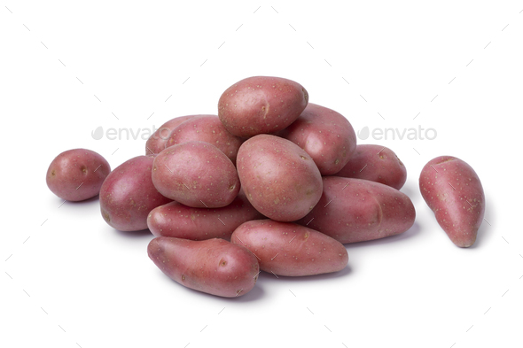 Heap of fresh small Roseval potatoes close up on white background - Stock Photo - Images