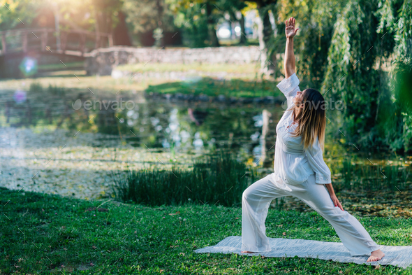 Yoga in Nature, Peaceful Warrior Pose. - Stock Photo - Images
