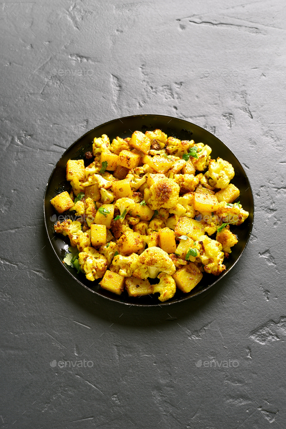 Indian style cauliflower with potatoes Stock Photo by voltan1 PhotoDune