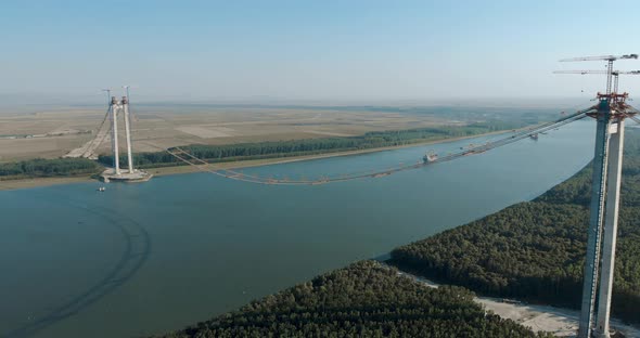 Danube River Spanned By Braila Bridge Under Construction With Towers And Main Cables alt