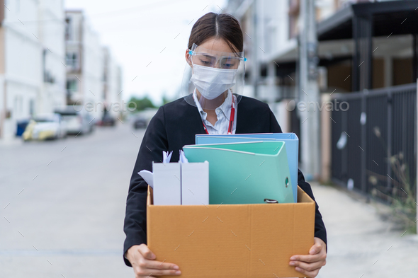 Asian business woman wear face mask after unemployment from company. - Stock Photo - Images