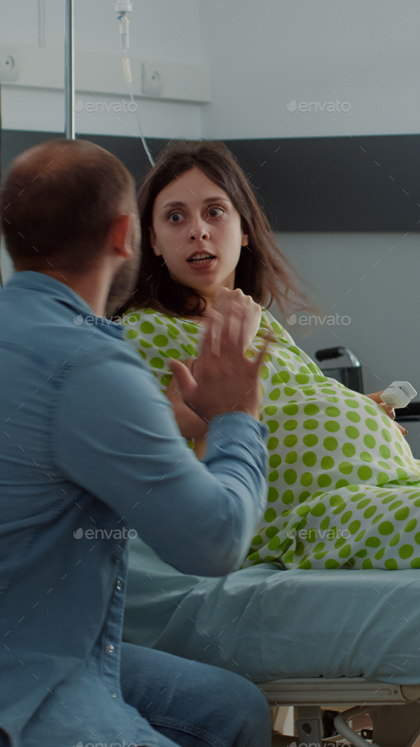 Caucasian pregnant woman getting labor contractions Stock Photo by DC ...