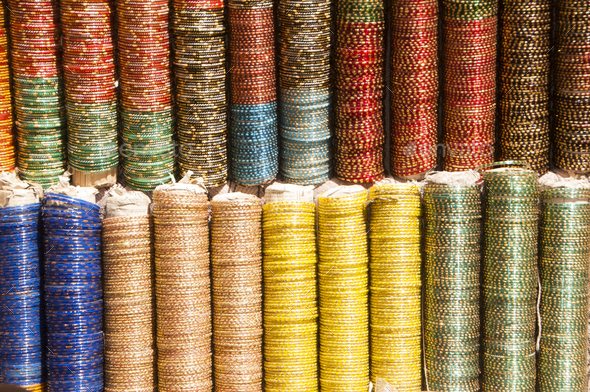 Background of colorful bangles stacked in a shop in India
