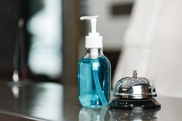 Antibacterial hand sanitizer gel on hotel front desk