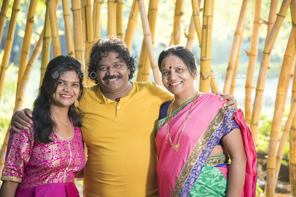 Happy Indian family at outdoors, Enjoying holiday in park. Stock Photo ...