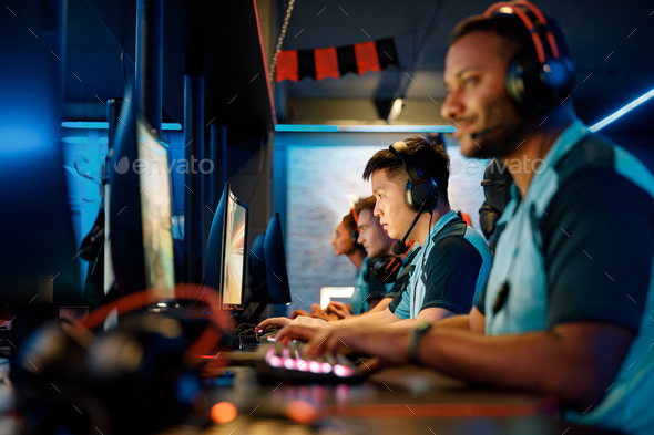 Professional team playing multiplayer video game in cyber club Stock Photo  by astakhovyaroslav