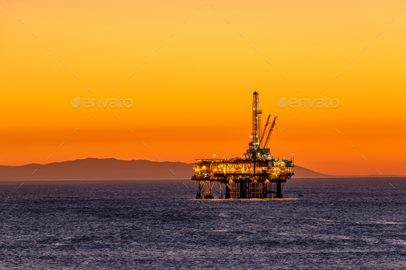 Offshore oil platform at dusk - Stock Photo - Images