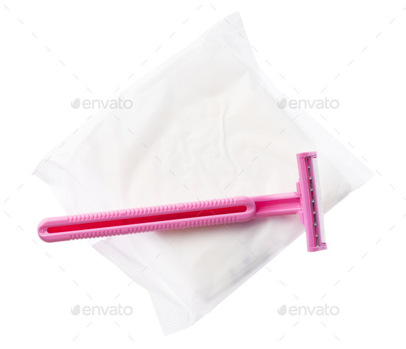 Women pad and disposable razor isolated on white