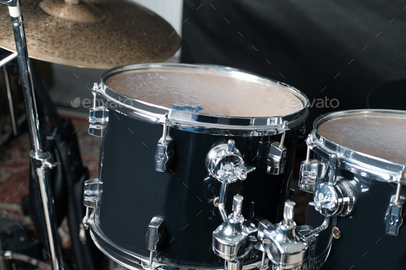 modern drum set in a rehearsal room. music equipment for stage and studio performance