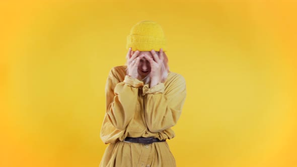 Young Upset Woman Having Headache, Studio Portrait. Girl Putting Hands on Head alt