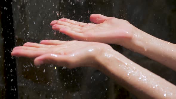 Woman's Hands with Water Splash