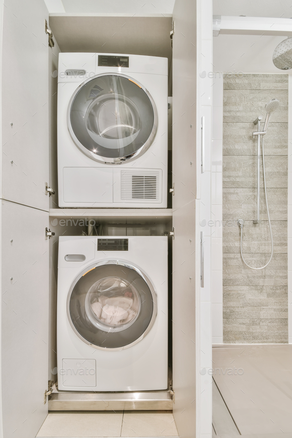 Laundry area with washer and dryer - Stock Photo - Images