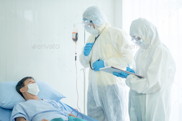 Doctor with whole body cover suit explain about patient disease progression and nurse record