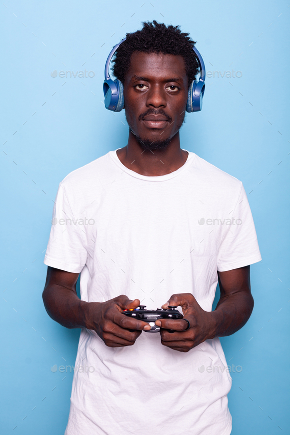 Portrait of man playing video games with controller