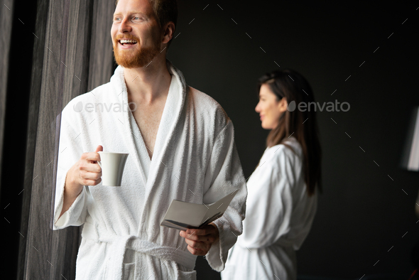 Handsome man in bathrobe relaxing at spa wellness hotel
