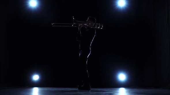 Musician Playing on Trombone, Solo Concert, Dark Studio, Slow Motion alt