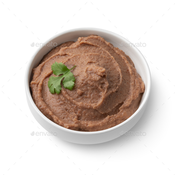 Bowl with brown refried beans paste close up on white background - Stock Photo - Images
