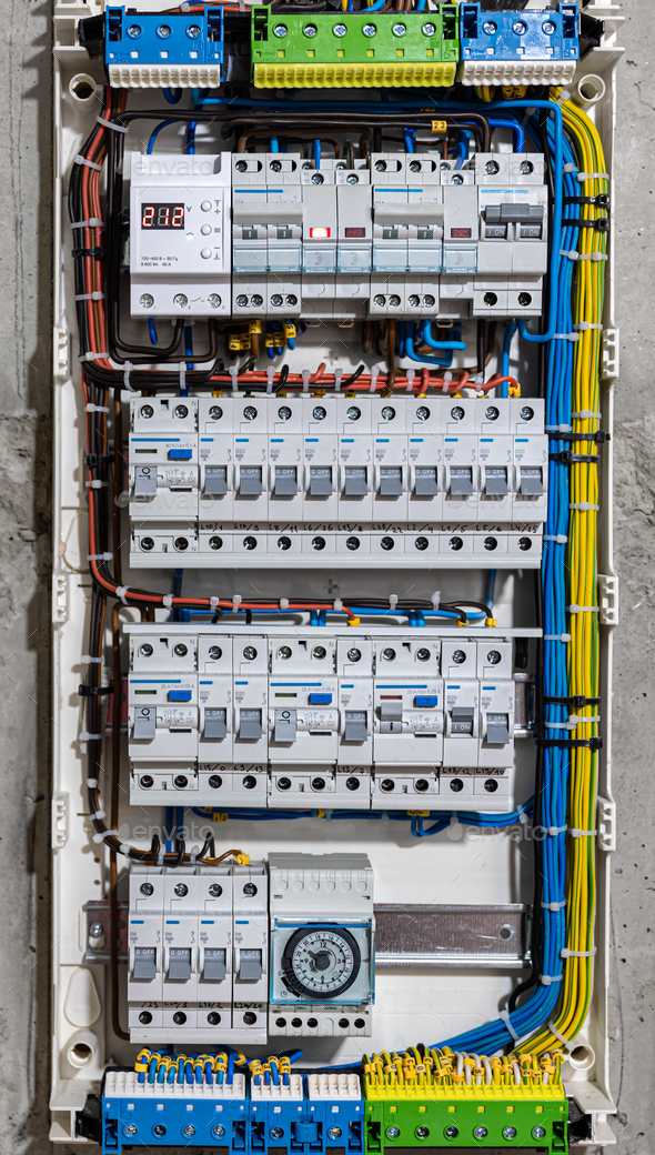 Voltage switchboard with circuit breakers, close up. Stock Photo by puhimec