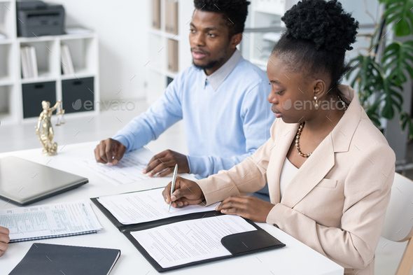 African American Couple Signing Papers