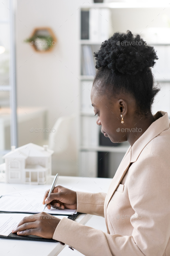Blackwoman Signing Mortgage Document - Stock Photo - Images