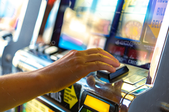 Caucasian Woman Playing Slot Machine Game - Stock Photo - Images