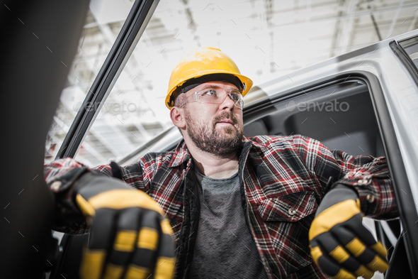 Caucasian Contractor Worker Inside His Pickup Truck - Stock Photo - Images