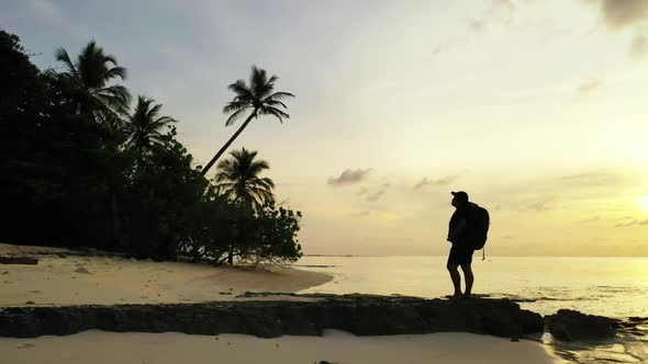 Woman sunbathes on marine sea view beach wildlife by blue lagoon and white sandy background of the M alt