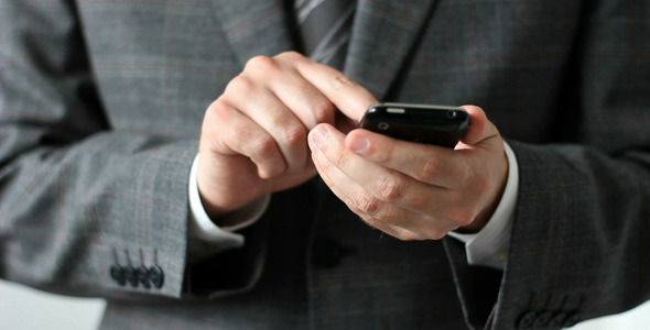 Businessman Working With Mobile Phone