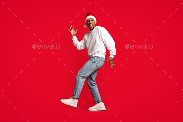 Emotional african american guy having New Year disco