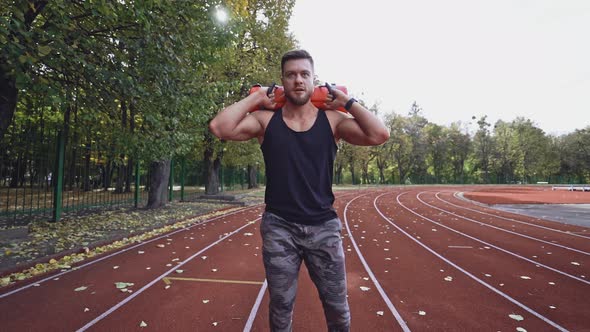 Young man doing workout. Man doing fitness workout outdoors alt