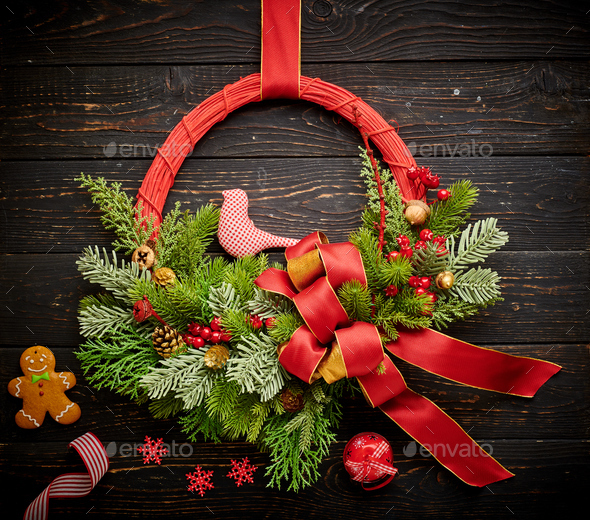 Christmas wreath on dark wooden background - Stock Photo - Images