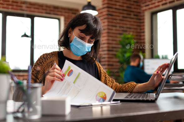 Businesswoman with medical face mask to prevent infection with coronavirus