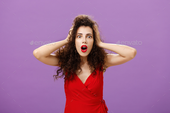 You do not say. Portrait of shocked and impressed speechless woman with curly haircut in luxurious