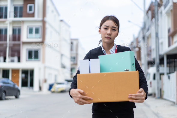 Asian upset business woman walk outdoor after unemployment from company. - Stock Photo - Images