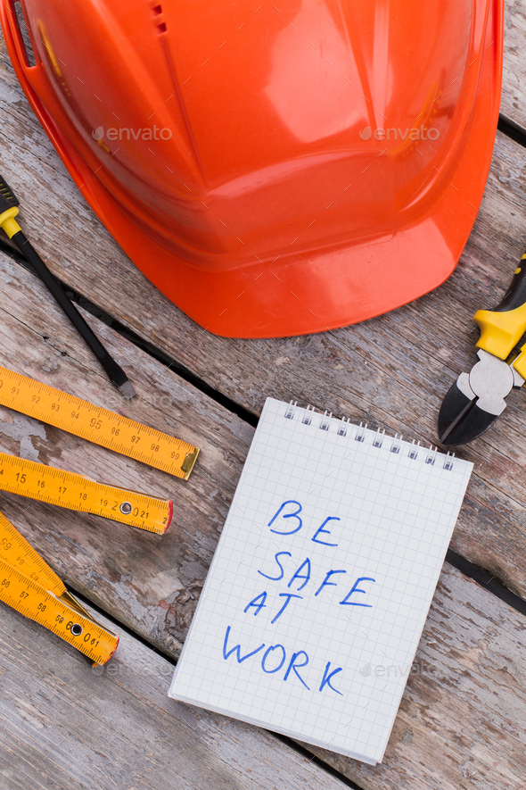 Be safe at work slogan and constructor accessories.