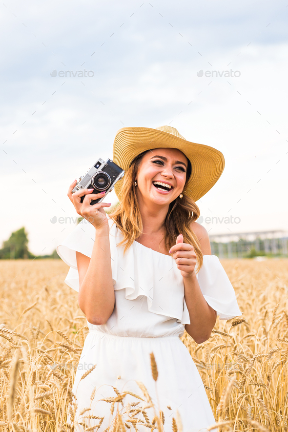 Woman holding retro camera