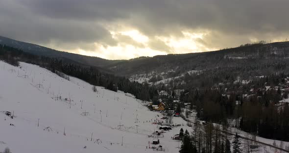 Forest Covered with Snow Aerial View. Aerial View of Village in Mountains alt