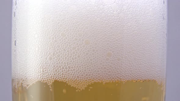 beer bubbles in a glass close-up, timelapse