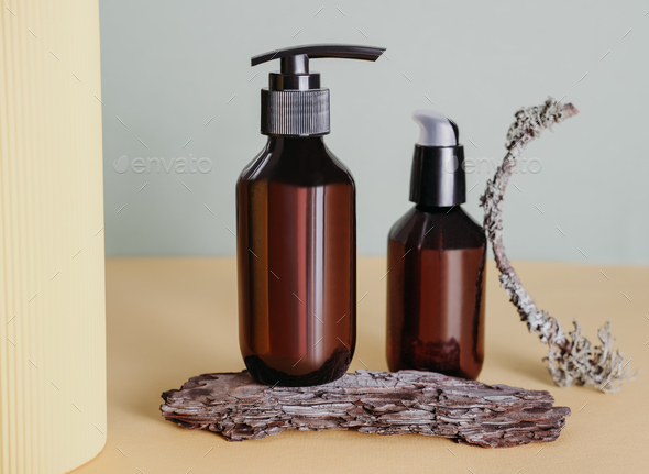Brown bottles with pump of cosmetic products