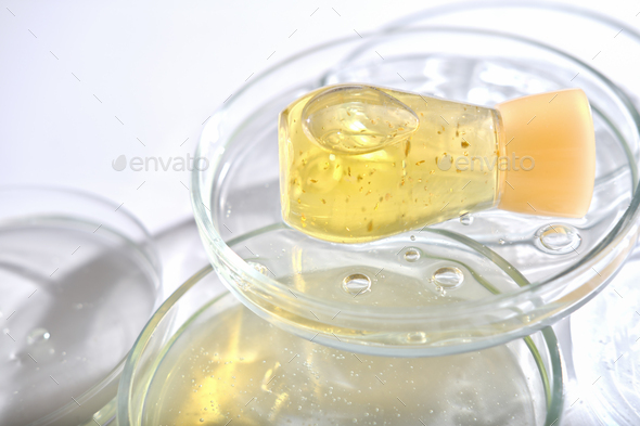 yellow bottle serum solution for sensitive skin on petri dishes
