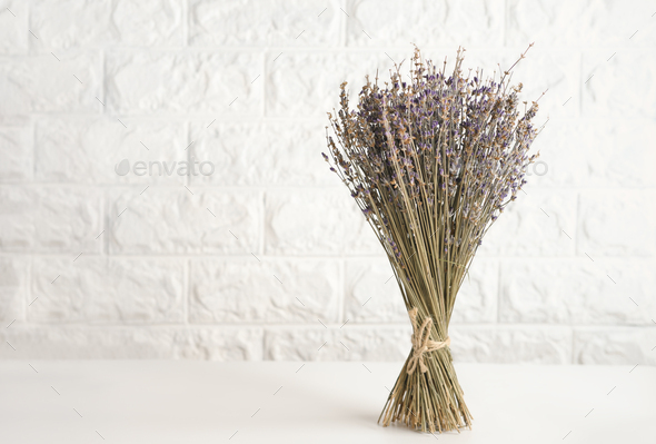 a bunch of dry lavender flowers on a kitchen table.