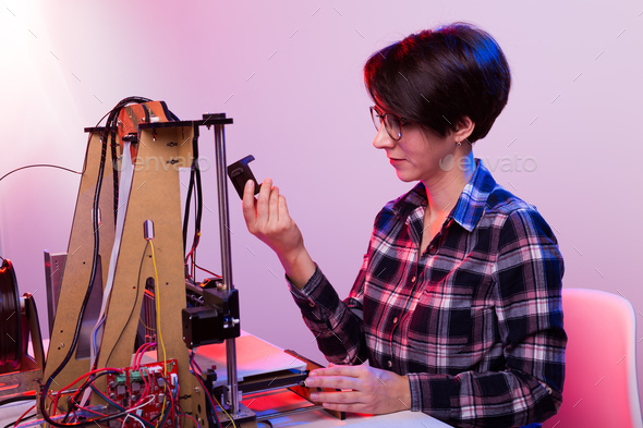 A student woman print prototype on 3D printer