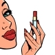 A Woman Paints Her Lips with Red Lipstick Makeup